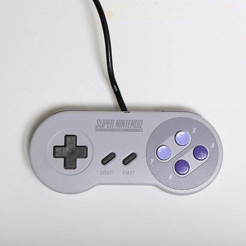 https://media.gamestop.com/i/gamestop/10122904/Nintendo-Super-NES-Controller?$pdp$